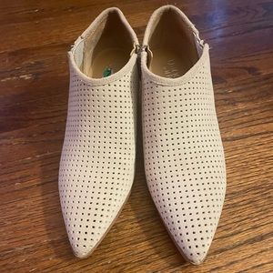 Franco Sarto perforated cream leather ankle booties.